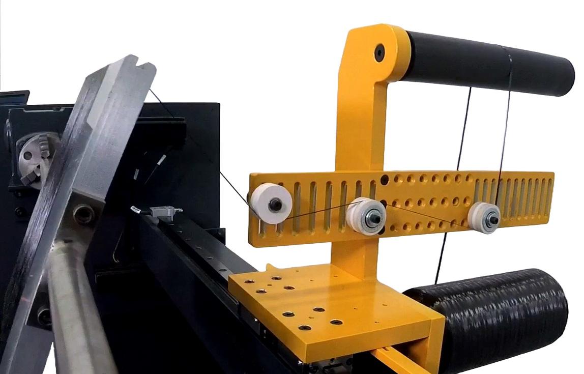 Integrated single-tow tensioning creel on the ETC SC Filament Winder guiding carbon fiber tow (close-up).